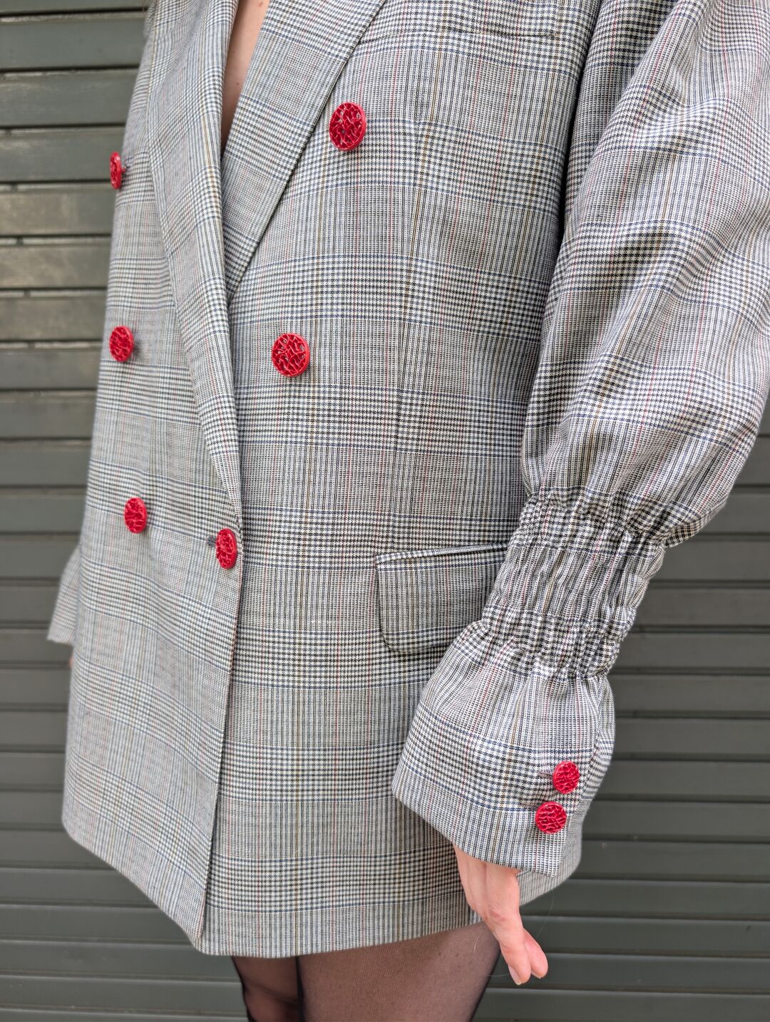Red jewellery buttons and gathered sleeve detail